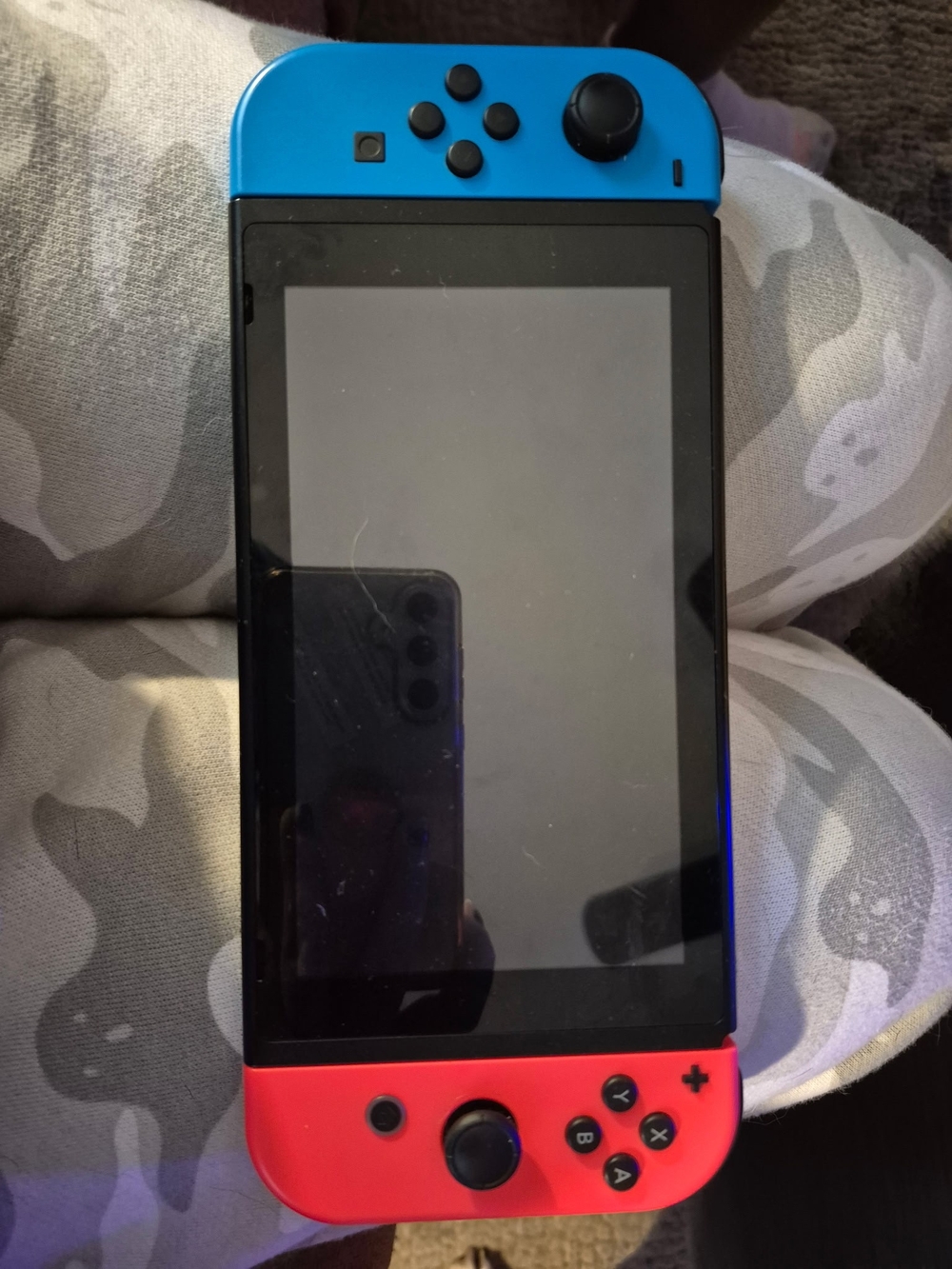 Nintendo Switch with Neon Red and Neon Blue Joy-Cons